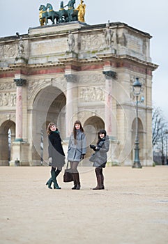 Three joyful girls together in Paris