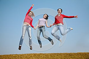 Three jumping girls