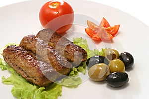 Three kebab rolls on dish