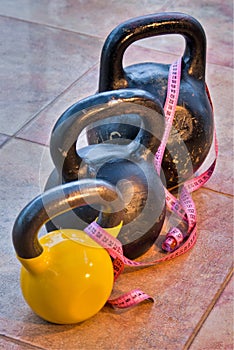 Three kettlebells on flagging