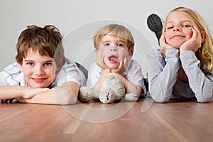 Three kids on the floor photo