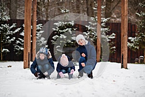 Three kids playing in winter day. Brothers with yongest sister