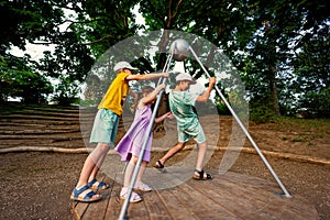 Three kids rides on the playground. Centrifuge, swing for children