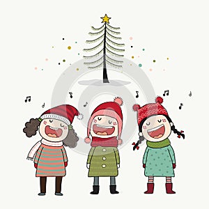 Three kids singing Christmas caroling with pine tree.