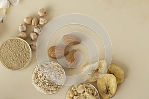 Three kinds of gluten-free flour on a beige background. Chickpea, almond and banana. Useful Foods