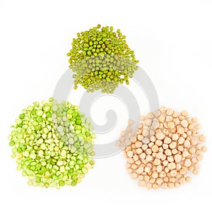 Three kinds of raw dried legumes - chickpeas, mung bean, green peas, isolated on white background