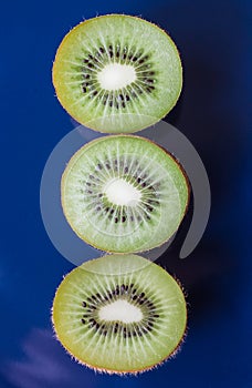 Three kiwis half