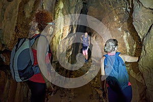 Three ladies exploring a cave