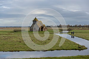 Three ladies photographing the Thomas a Becket Church