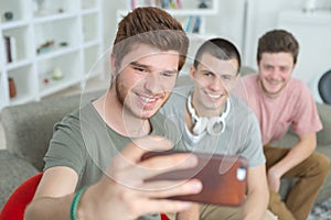 Three lads taking selfie