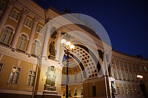 Three lanterns shine brightly in night Petersburg