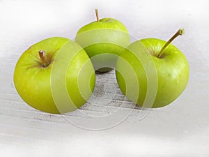Three large green apples