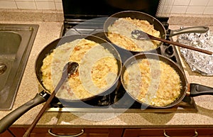 Three large pots with the typical dish called FRICO Of the Itali