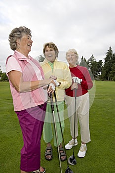 Three Laughing Golfers