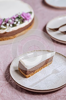 Three layered chocolate cheesecake decorated in festive mood