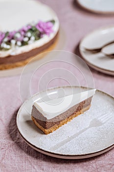 Three layered chocolate cheesecake decorated in festive mood