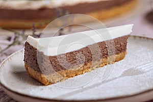 Three layered chocolate cheesecake decorated in festive mood