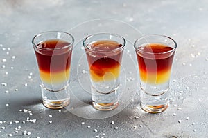 Three layered shots. Set of cocktails at the bar. alcoholic cocktail drinks shot