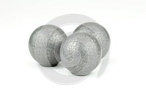 Three lead musket balls on white background