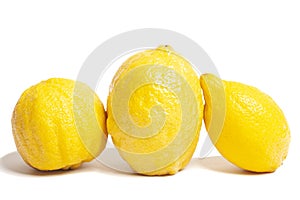 Three lemons isolated on white background. Tropical fruit