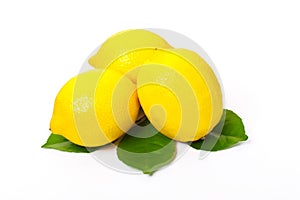 Three lemons and lemon leaves