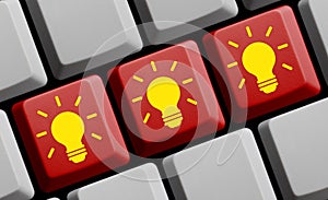 Creativity online - Light Bulbs on computer keyboard 3D illustration