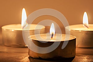 Three light candles with fire meditative relaxing macro wallpaper