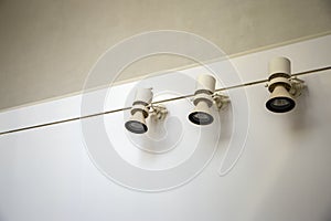 Three lighters on white wall