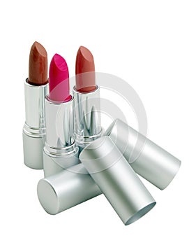 Three lipsticks isolated over white background