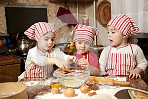 Three little chefs in the kitchen