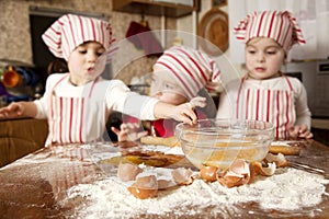 Three little chefs in the kitchen