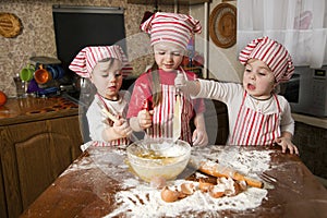 Three little chefs in the kitchen