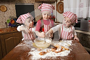 Three little chefs in the kitchen