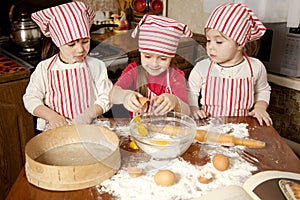 Three little chefs in the kitchen