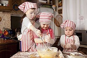 Three little chefs in the kitchen