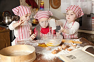 Three little chefs in the kitchen