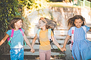 Three little girls going to school