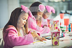 Three little girls having a party at home.