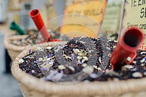 Three little shovels inside different tea mixtures photo