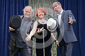 Three lively performers on stage