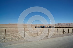 three locomotives pulling gas tank wagons through the Atacama desert