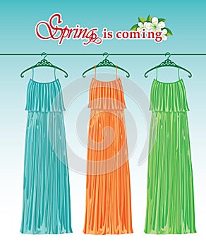 Three long spring party dresses on a hanger. Fashio