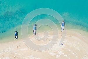 Three long tail boat on the beach aerial view