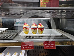 Three lovely delicious pineapple cake in the bakery photo