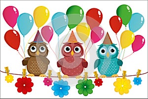 Three lovely owls sit on a rope and hold balloons.