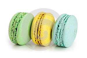 Three macaroons isolated on white background closeup