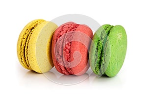 Three macaroons isolated on white background closeup