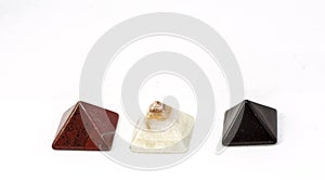 Three magical pyramid made of red jasper, onyx and obsidian.