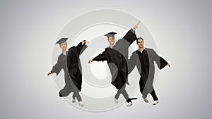Three male graduates in robes and mortarboards dancing in synch