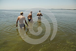 Three man on the river